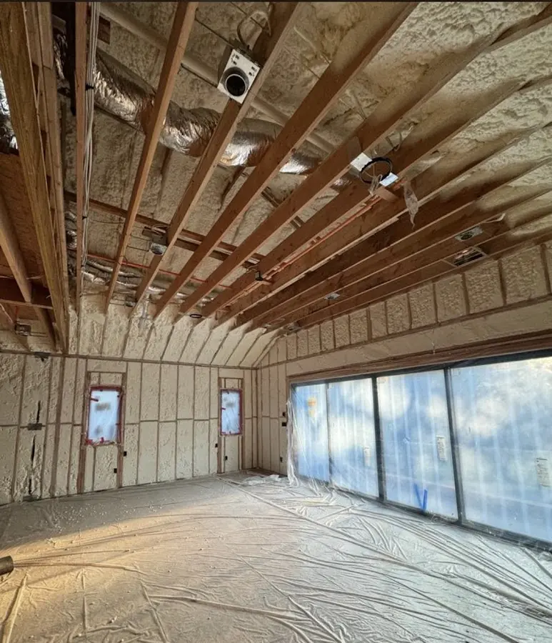 Interior walls and ceiling insulated with spray foam during new construction in Lehi